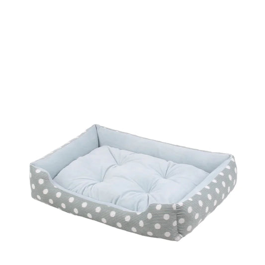 Pet bed with a polka dot pattern on a white background